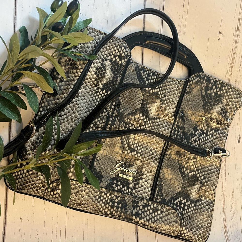 Small purse with snake printing.